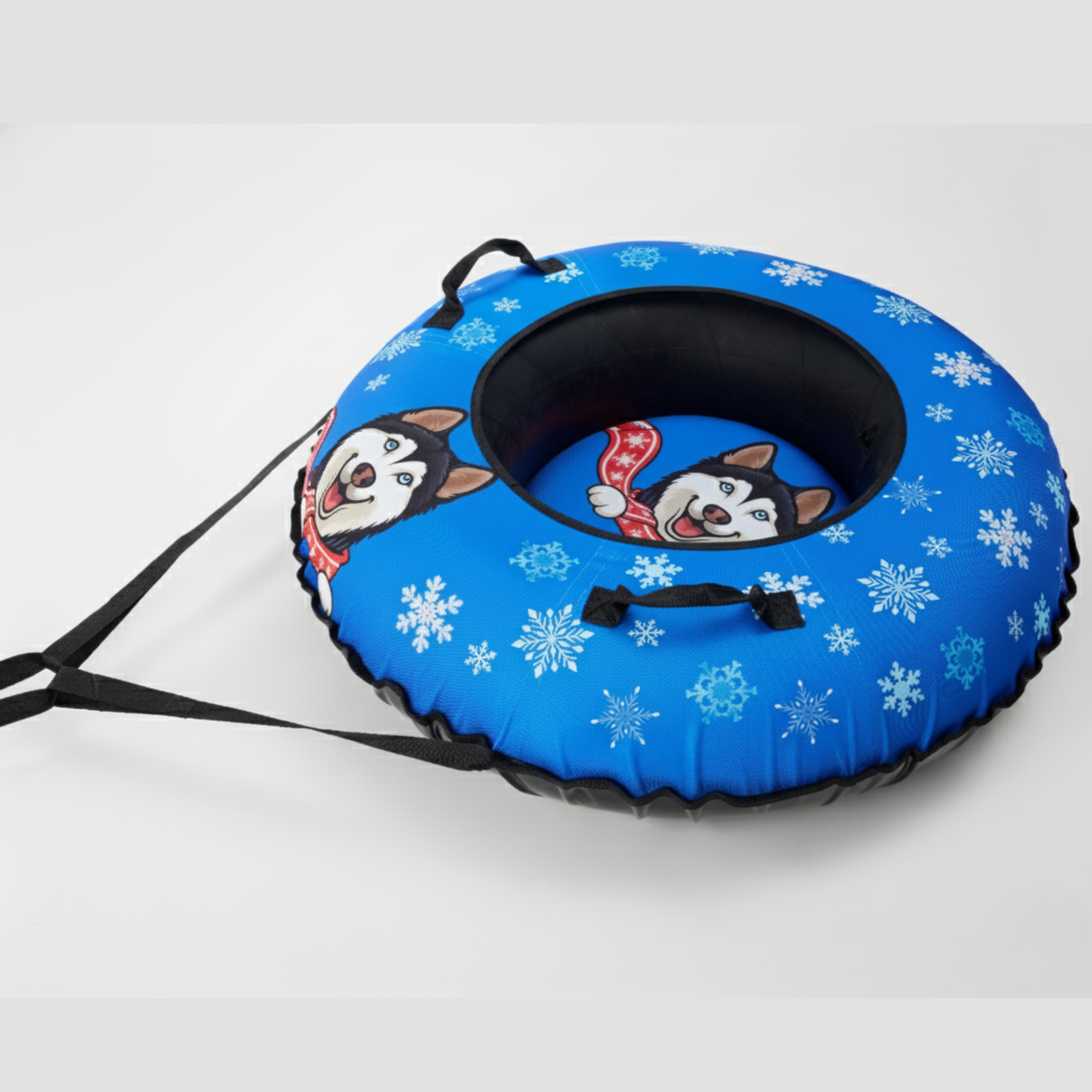 Blue snow tube with cartoon dog design and snowflake pattern on a white background