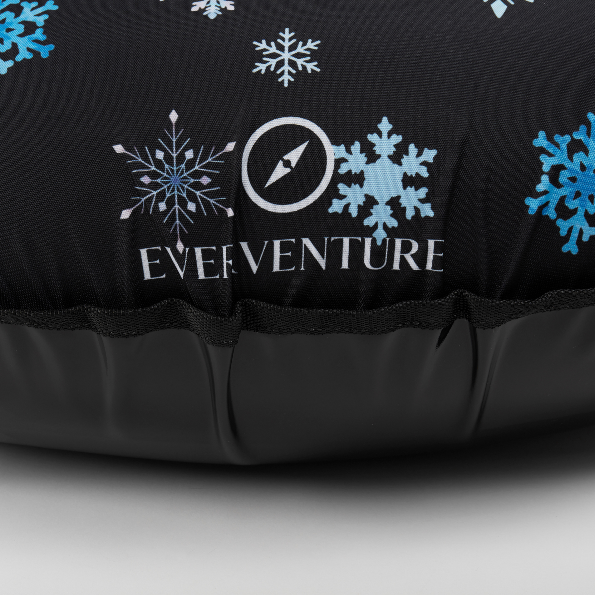 Black sleeping bag with snowflake patterns and 'Everaventure' logo on a gray background