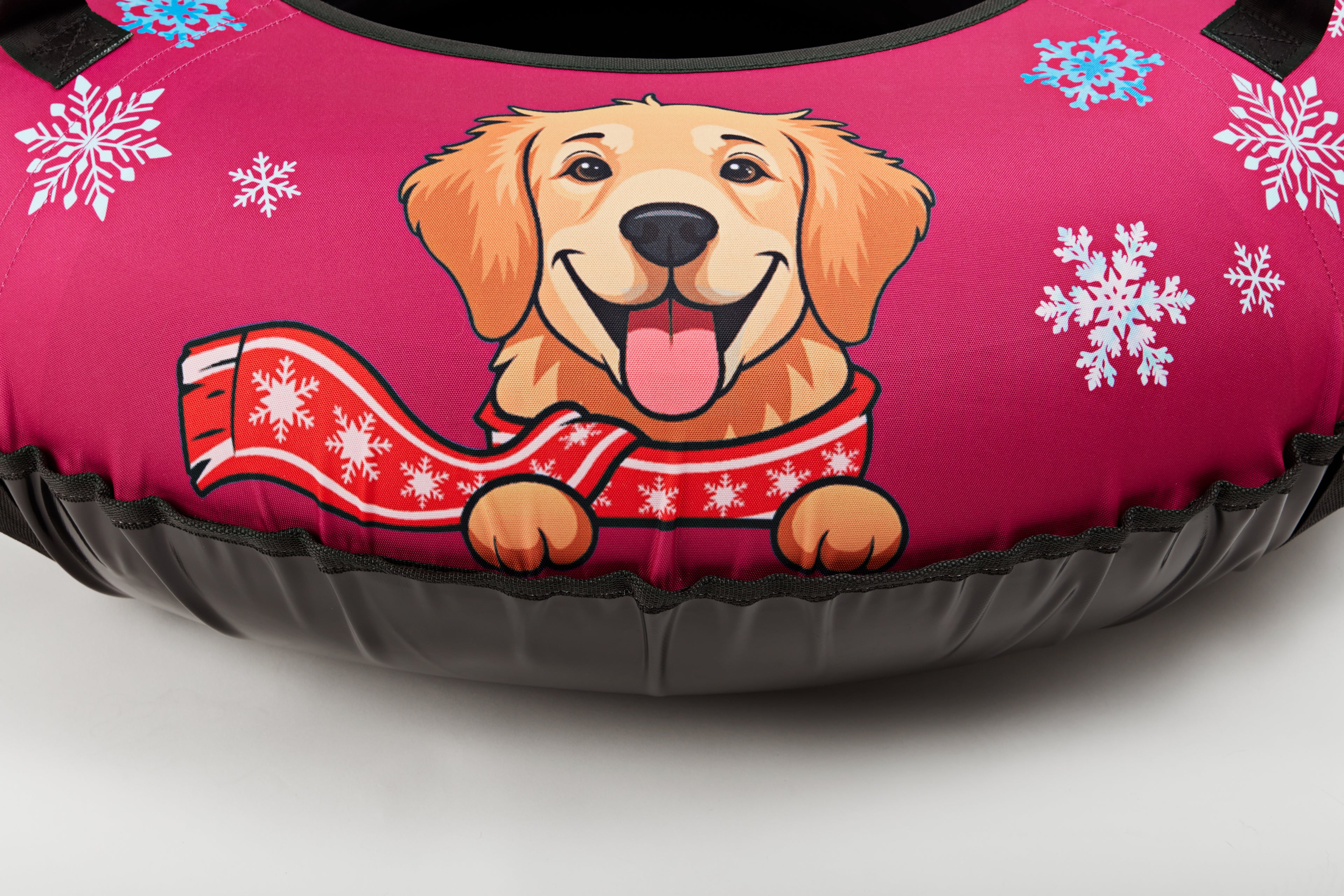 Dog bed with a cartoon dog wearing a scarf and snowflakes on a pink background