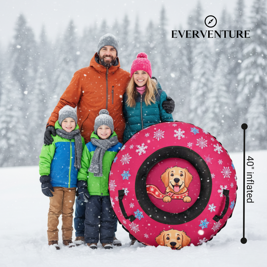 Family posing with a pink sled featuring cartoon dogs in the snow, branded 'Everventure'.