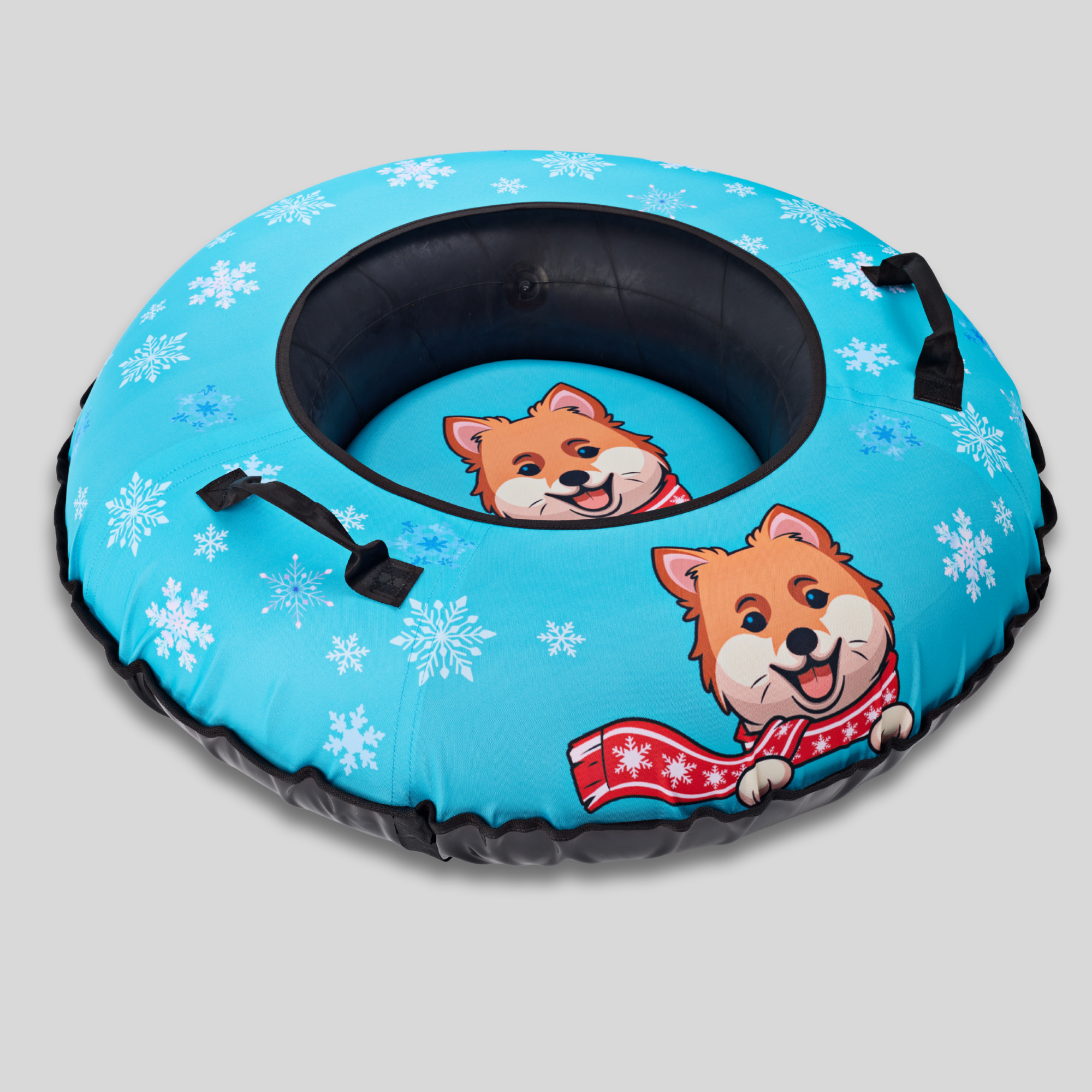 Inflatable snow tube with cartoon dogs and snowflakes on a gray background